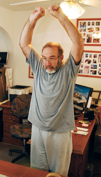 Man stretching his shoulders