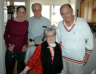The author, center, in January, 2010, with her new trach; next to her is her father, and behind them is family friend Anne and Jan’s husband, Milton.