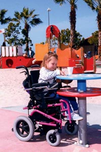 A girl coloring on the playground