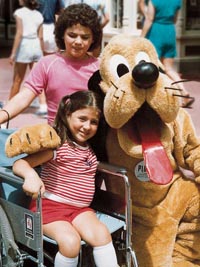Girl at theme park with her brother.
