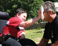 Camper giving a volunteer a pie in the face
