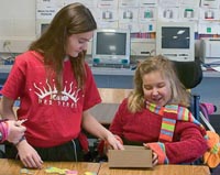 Students putting a puzzle together.