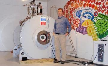 Sean Forbes (DMD/BMD) : Forbes stands near a 4.7 Tesla magnet at the Advanced Magnetic Resonance Imaging and Spectroscopy (AMRIS) facility at the University of Florida. He will be using magnetic resonance imaging and spectroscopy to measure muscle metabolism in mouse models of Duchenne muscular dystrophy.