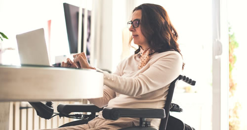 Images of a woman in a wheelchair working on a laptop.