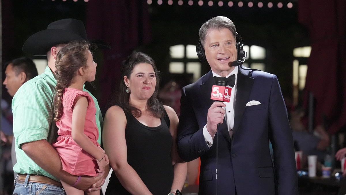 Host and family standing on stage at the 2024 MDA Show of Strength.