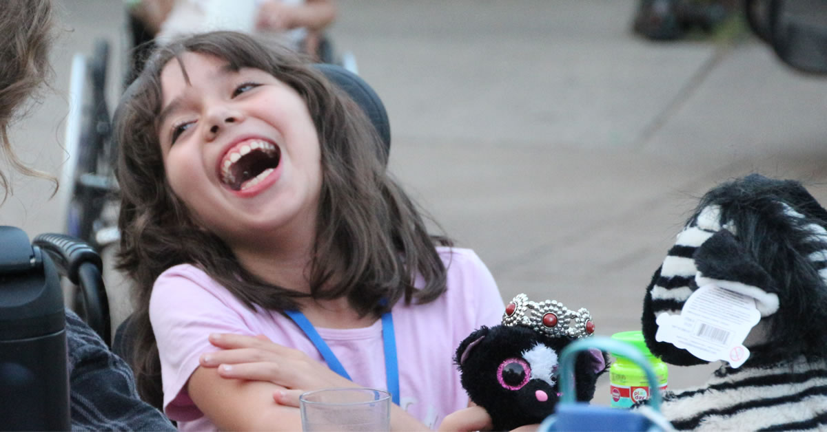 Image of a young girl laughing.